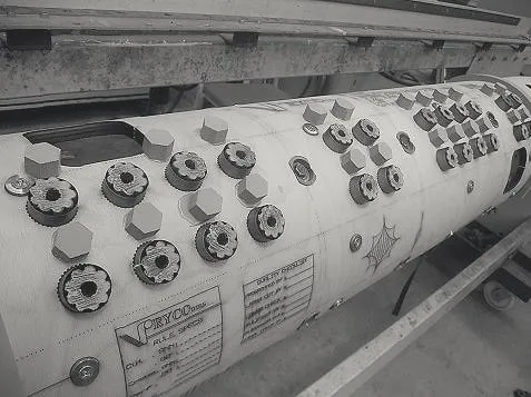 Rotary die fitted with grey and blue ejection rubber, the Ryco mark etched on the shell